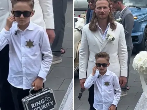 Chłopiec w okularach przeciwsłonecznych, z odznaką i walizką "Ring Security", niesie obrączki do ślubu.